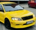 Желтый Мицубиси Лансер, объемом двигателя 2 л и пробегом 263 тыс. км за 4500 $, фото 1 на Automoto.ua