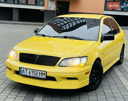 Желтый Мицубиси Лансер, объемом двигателя 2 л и пробегом 263 тыс. км за 4500 $, фото 28 на Automoto.ua