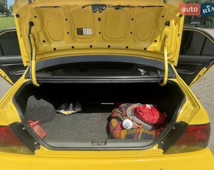 Мицубиси Лансер 2002 в Ивано-Франковске на Automoto.ua Желтый Мицубиси Лансер, объемом двигателя 2 л и пробегом 262 тыс. км за 3999 $, фото 12 на Automoto.ua