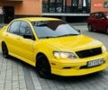 Желтый Мицубиси Лансер, объемом двигателя 2 л и пробегом 263 тыс. км за 4500 $, фото 1 на Automoto.ua