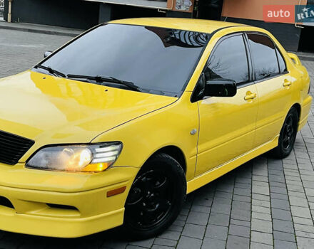 Желтый Мицубиси Лансер, объемом двигателя 2 л и пробегом 263 тыс. км за 4500 $, фото 15 на Automoto.ua