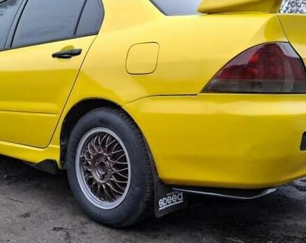 Желтый Мицубиси Лансер, объемом двигателя 1.3 л и пробегом 380 тыс. км за 3500 $, фото 16 на Automoto.ua