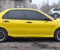 Желтый Мицубиси Лансер, объемом двигателя 1.3 л и пробегом 380 тыс. км за 3500 $, фото 13 на Automoto.ua