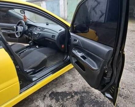 Желтый Мицубиси Лансер, объемом двигателя 1.3 л и пробегом 380 тыс. км за 3500 $, фото 5 на Automoto.ua