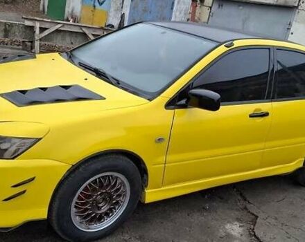 Желтый Мицубиси Лансер, объемом двигателя 1.3 л и пробегом 380 тыс. км за 3500 $, фото 2 на Automoto.ua