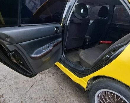 Жовтий Міцубісі Lancer, об'ємом двигуна 1.3 л та пробігом 380 тис. км за 3500 $, фото 8 на Automoto.ua