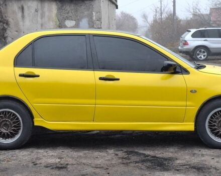 Жовтий Міцубісі Lancer, об'ємом двигуна 1.3 л та пробігом 380 тис. км за 3500 $, фото 14 на Automoto.ua
