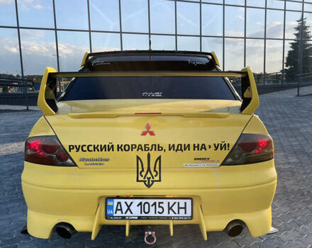 Желтый Мицубиси Лансер, объемом двигателя 2 л и пробегом 134 тыс. км за 16800 $, фото 7 на Automoto.ua