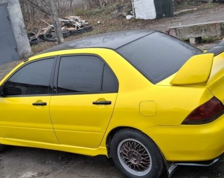 Жовтий Міцубісі Lancer, об'ємом двигуна 1.3 л та пробігом 380 тис. км за 3500 $, фото 13 на Automoto.ua