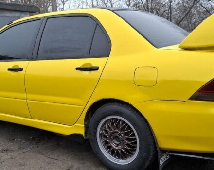 Жовтий Міцубісі Lancer, об'ємом двигуна 1.3 л та пробігом 380 тис. км за 3500 $, фото 18 на Automoto.ua