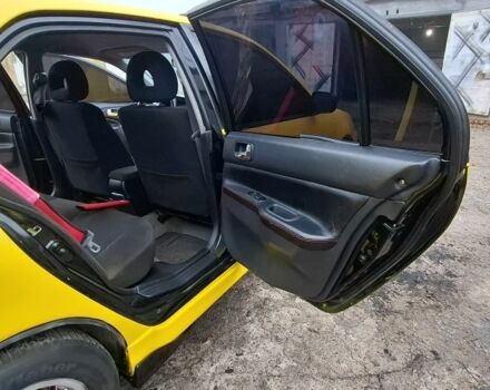 Жовтий Міцубісі Lancer, об'ємом двигуна 1.3 л та пробігом 380 тис. км за 3500 $, фото 7 на Automoto.ua