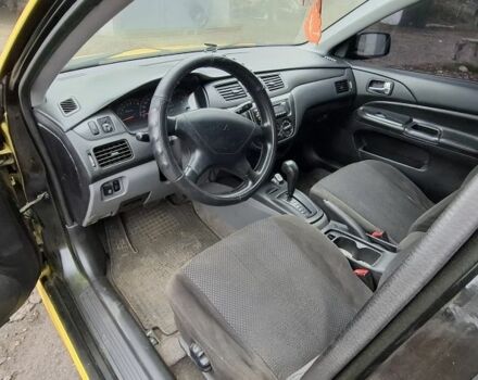 Жовтий Міцубісі Lancer, об'ємом двигуна 1.3 л та пробігом 380 тис. км за 3500 $, фото 10 на Automoto.ua