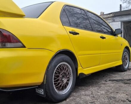 Жовтий Міцубісі Lancer, об'ємом двигуна 1.3 л та пробігом 380 тис. км за 3500 $, фото 5 на Automoto.ua