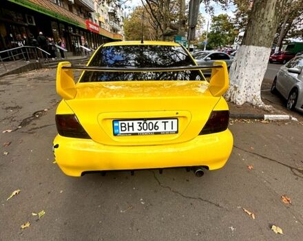 Жовтий Міцубісі Lancer, об'ємом двигуна 1.6 л та пробігом 1 тис. км за 3800 $, фото 2 на Automoto.ua