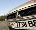Желтый Мицубиси Лансер, объемом двигателя 1.5 л и пробегом 128 тыс. км за 5900 $, фото 1 на Automoto.ua