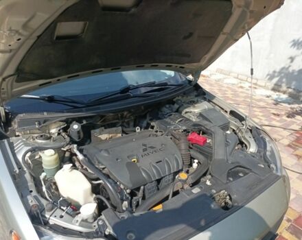 Желтый Мицубиси Лансер, объемом двигателя 2 л и пробегом 137 тыс. км за 7300 $, фото 5 на Automoto.ua