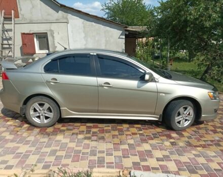 Желтый Мицубиси Лансер, объемом двигателя 2 л и пробегом 137 тыс. км за 7300 $, фото 3 на Automoto.ua