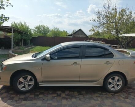 Желтый Мицубиси Лансер, объемом двигателя 2 л и пробегом 137 тыс. км за 7300 $, фото 4 на Automoto.ua