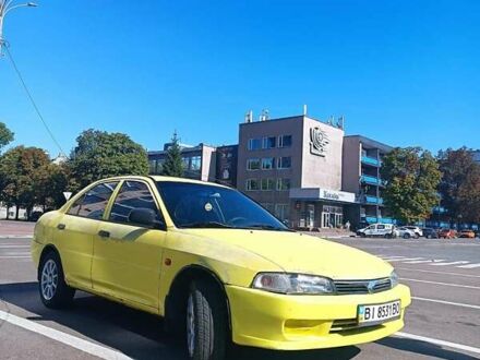 Жовтий Міцубісі Lancer, об'ємом двигуна 1.3 л та пробігом 306 тис. км за 1500 $, фото 1 на Automoto.ua