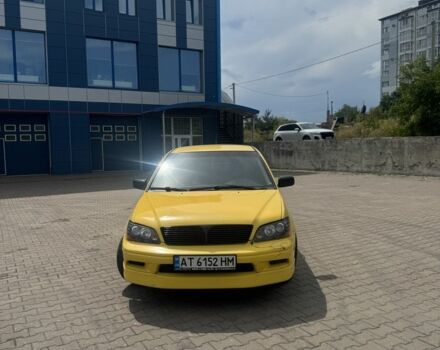 Жовтий Міцубісі Lancer, об'ємом двигуна 2 л та пробігом 262 тис. км за 3300 $, фото 1 на Automoto.ua