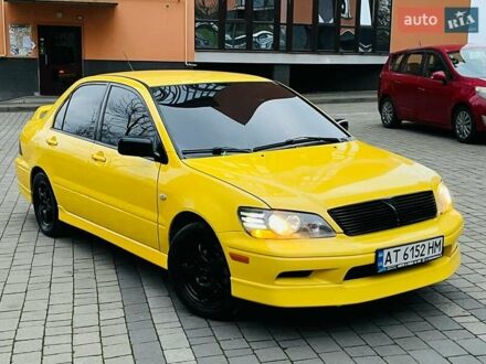 Желтый Мицубиси Лансер, объемом двигателя 2 л и пробегом 263 тыс. км за 4500 $, фото 1 на Automoto.ua