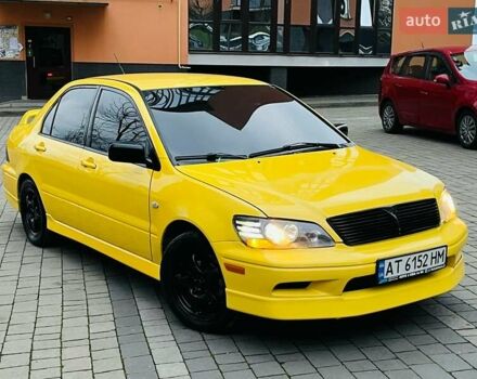 Желтый Мицубиси Лансер, объемом двигателя 2 л и пробегом 263 тыс. км за 4500 $, фото 1 на Automoto.ua