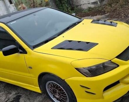 Желтый Мицубиси Лансер, объемом двигателя 1.3 л и пробегом 380 тыс. км за 3500 $, фото 1 на Automoto.ua