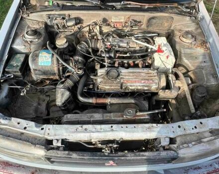 Серый Мицубиси Лансер, объемом двигателя 1.5 л и пробегом 190 тыс. км за 550 $, фото 1 на Automoto.ua