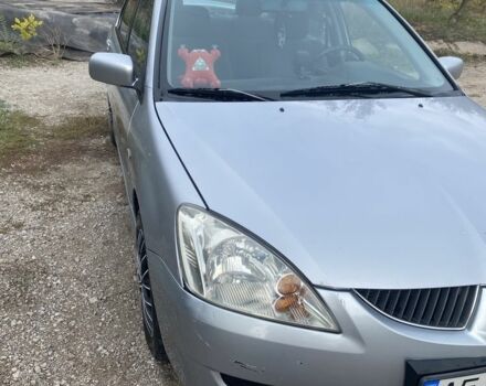 Серый Мицубиси Лансер, объемом двигателя 1.6 л и пробегом 289 тыс. км за 3150 $, фото 1 на Automoto.ua