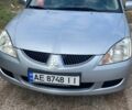 Серый Мицубиси Лансер, объемом двигателя 1.6 л и пробегом 289 тыс. км за 3150 $, фото 1 на Automoto.ua