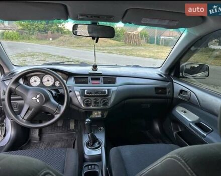 Серый Мицубиси Лансер, объемом двигателя 1.6 л и пробегом 197 тыс. км за 4200 $, фото 5 на Automoto.ua