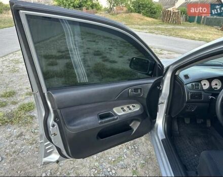 Серый Мицубиси Лансер, объемом двигателя 1.6 л и пробегом 197 тыс. км за 4200 $, фото 3 на Automoto.ua