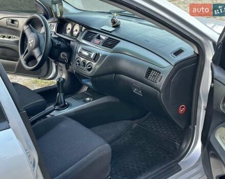 Серый Мицубиси Лансер, объемом двигателя 1.6 л и пробегом 197 тыс. км за 4200 $, фото 6 на Automoto.ua