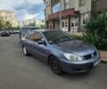 Серый Мицубиси Лансер, объемом двигателя 1.6 л и пробегом 299 тыс. км за 3200 $, фото 1 на Automoto.ua