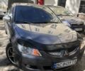 Серый Мицубиси Лансер, объемом двигателя 1.6 л и пробегом 318 тыс. км за 3500 $, фото 1 на Automoto.ua