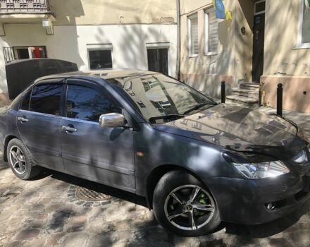 Серый Мицубиси Лансер, объемом двигателя 1.6 л и пробегом 318 тыс. км за 3350 $, фото 1 на Automoto.ua