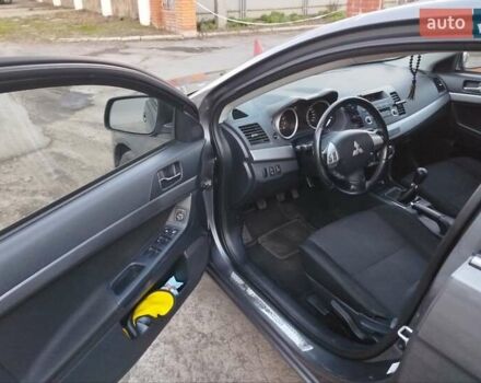 Серый Мицубиси Лансер, объемом двигателя 1.59 л и пробегом 226 тыс. км за 6600 $, фото 1 на Automoto.ua