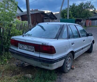 Сірий Міцубісі Lancer, об'ємом двигуна 1.5 л та пробігом 678 тис. км за 474 $, фото 1 на Automoto.ua