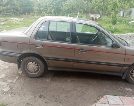 Сірий Міцубісі Lancer, об'ємом двигуна 1 л та пробігом 250 тис. км за 1250 $, фото 2 на Automoto.ua