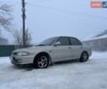 Серый Мицубиси Лансер, объемом двигателя 1.6 л и пробегом 300 тыс. км за 2100 $, фото 1 на Automoto.ua