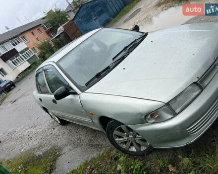 Серый Мицубиси Лансер, объемом двигателя 1.3 л и пробегом 217 тыс. км за 1000 $, фото 6 на Automoto.ua