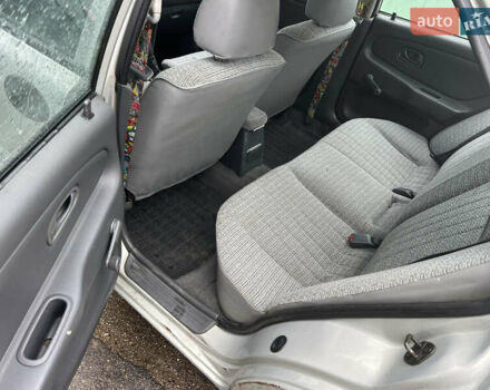 Серый Мицубиси Лансер, объемом двигателя 1.3 л и пробегом 217 тыс. км за 1000 $, фото 5 на Automoto.ua