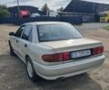 Сірий Міцубісі Lancer, об'ємом двигуна 1.3 л та пробігом 1 тис. км за 2000 $, фото 4 на Automoto.ua