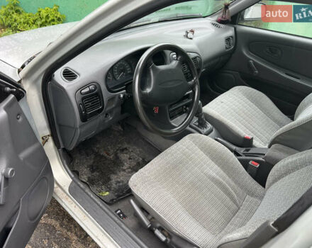 Серый Мицубиси Лансер, объемом двигателя 1.3 л и пробегом 218 тыс. км за 1000 $, фото 2 на Automoto.ua