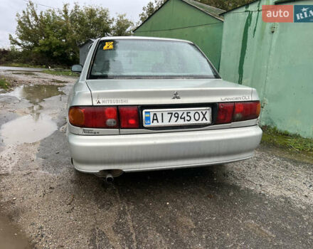 Серый Мицубиси Лансер, объемом двигателя 1.3 л и пробегом 218 тыс. км за 1000 $, фото 5 на Automoto.ua