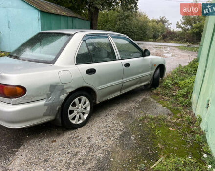 Серый Мицубиси Лансер, объемом двигателя 1.3 л и пробегом 217 тыс. км за 1000 $, фото 1 на Automoto.ua