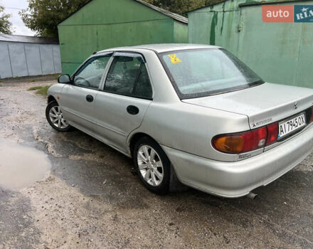 Серый Мицубиси Лансер, объемом двигателя 1.3 л и пробегом 217 тыс. км за 1000 $, фото 3 на Automoto.ua