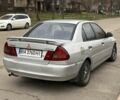 Сірий Міцубісі Lancer, об'ємом двигуна 1.3 л та пробігом 200 тис. км за 1100 $, фото 2 на Automoto.ua