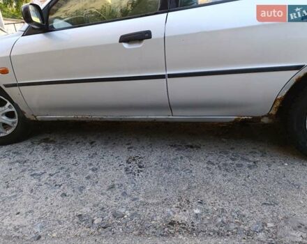 Сірий Міцубісі Lancer, об'ємом двигуна 1.3 л та пробігом 371 тис. км за 990 $, фото 7 на Automoto.ua