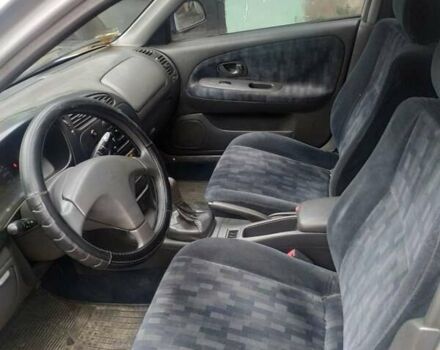 Серый Мицубиси Лансер, объемом двигателя 1.3 л и пробегом 367 тыс. км за 1050 $, фото 13 на Automoto.ua